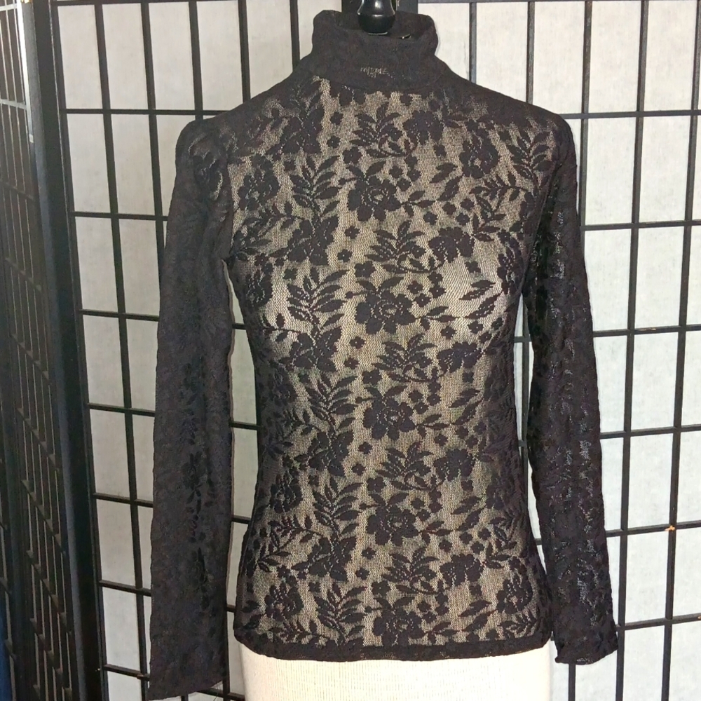 Vivat long sleeve turtleneck  top. Size D40/US8. Made in Turkey.